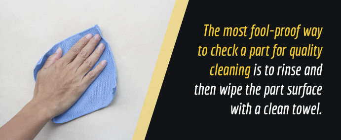 wipe an electrocleaned surface with a towel